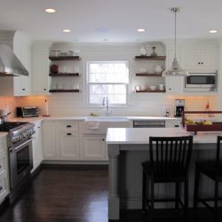 View to sink with floating walnut shelves