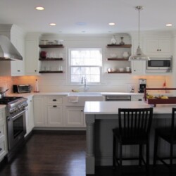 View to sink with floating walnut shelves