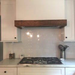 Reclaimed wood trim at hood vent.